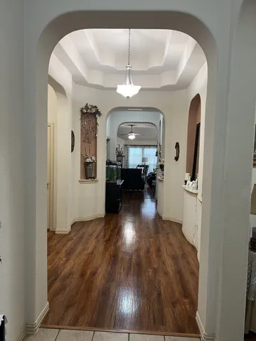 a view of livingroom and hardwood floor