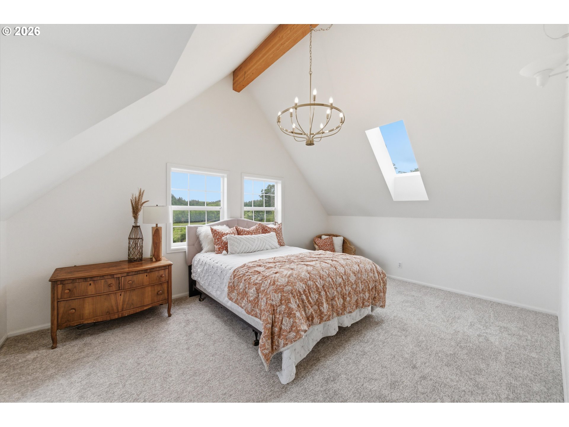 13880 McCaleb Road Monmouth, OR 97361 - Photo 35 of 44 a living room with a bed furniture and a chandelier