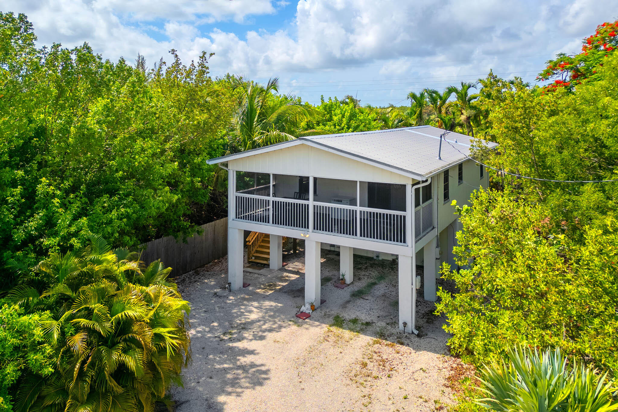 29951 Pine Channel Road Big Pine Key, FL 33043 - Photo 1 of 61 a house with trees in front of it