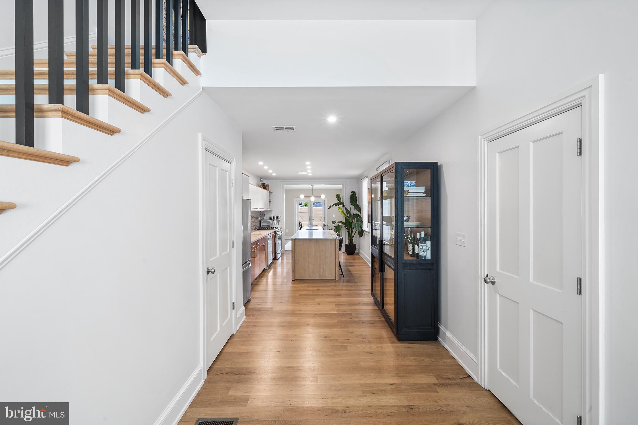 1509 Reed Street Philadelphia, PA 19146 - Photo 9 of 34 View from LR to kitchen. Half bath on right