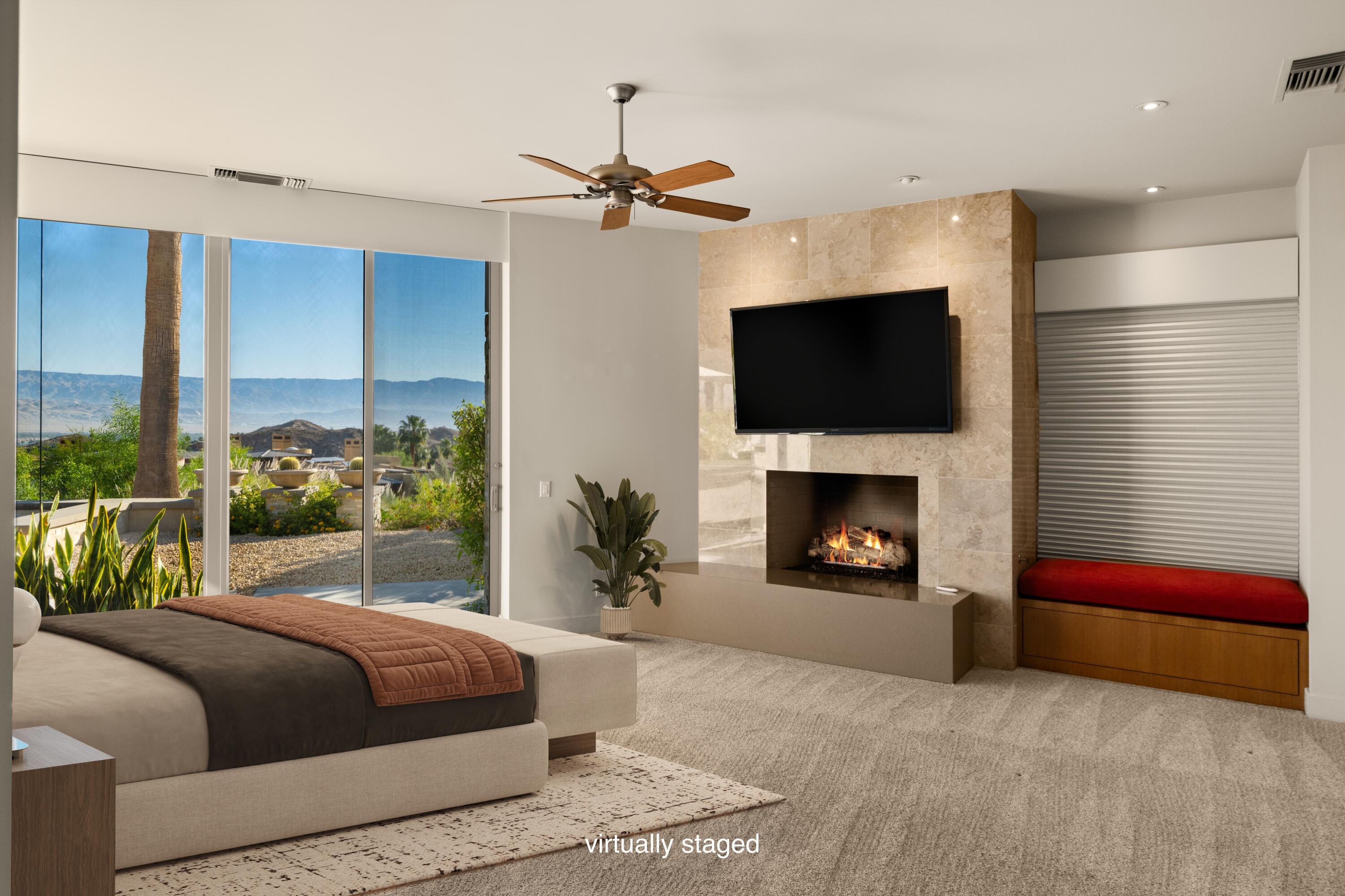 30 Hillcrest Drive Rancho Mirage, CA 92270 - Photo 13 of 79 a bedroom with a bed and a fireplace