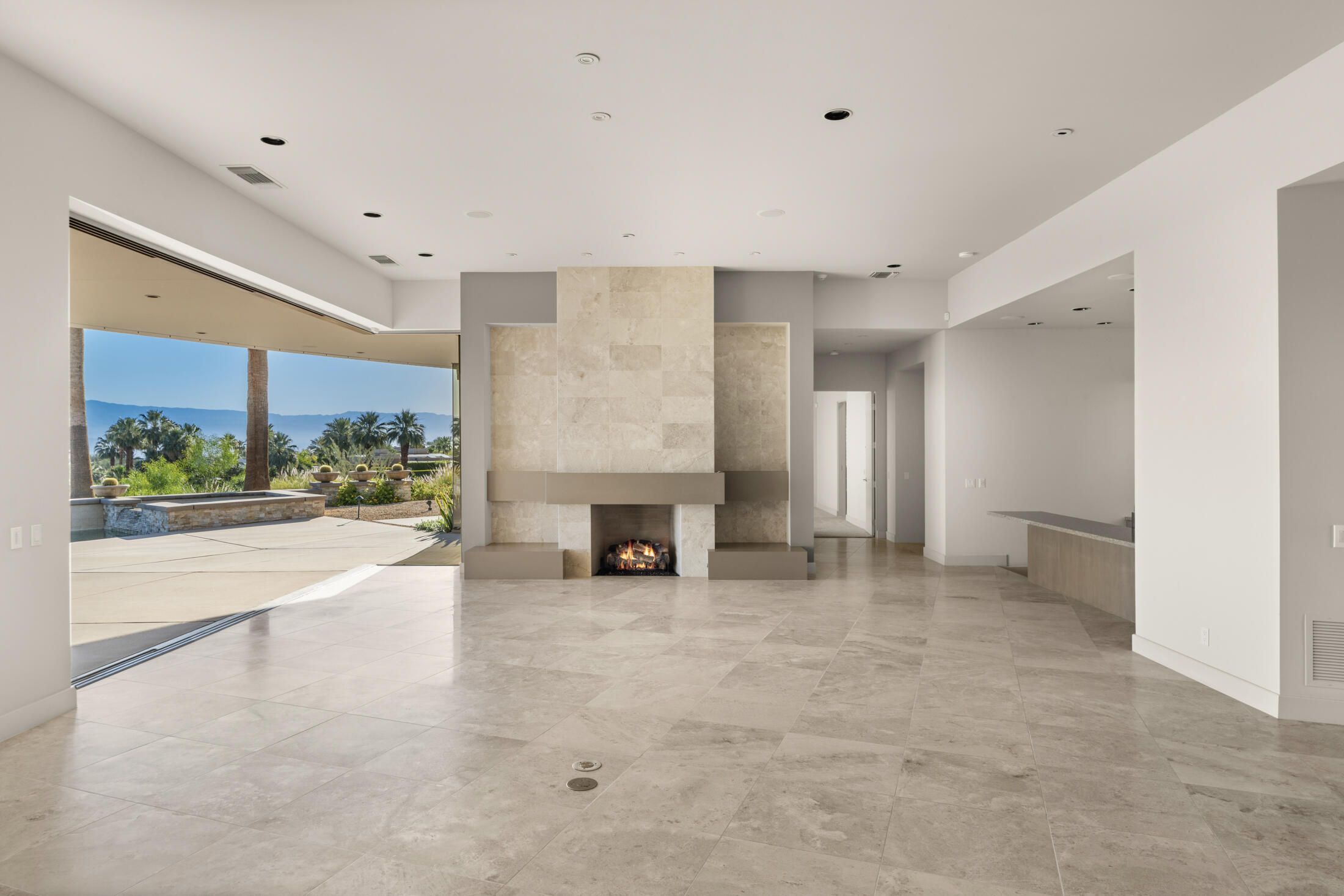 30 Hillcrest Drive Rancho Mirage, CA 92270 - Photo 24 of 79 a view of an empty room with a fireplace and a window
