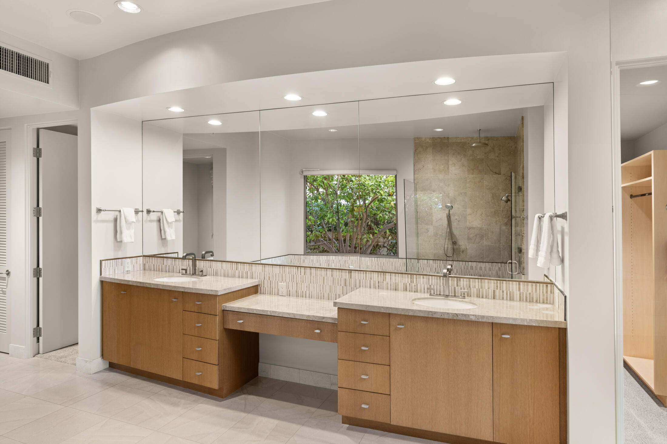 30 Hillcrest Drive Rancho Mirage, CA 92270 - Photo 51 of 79 a bathroom with a sink double vanity and a mirror