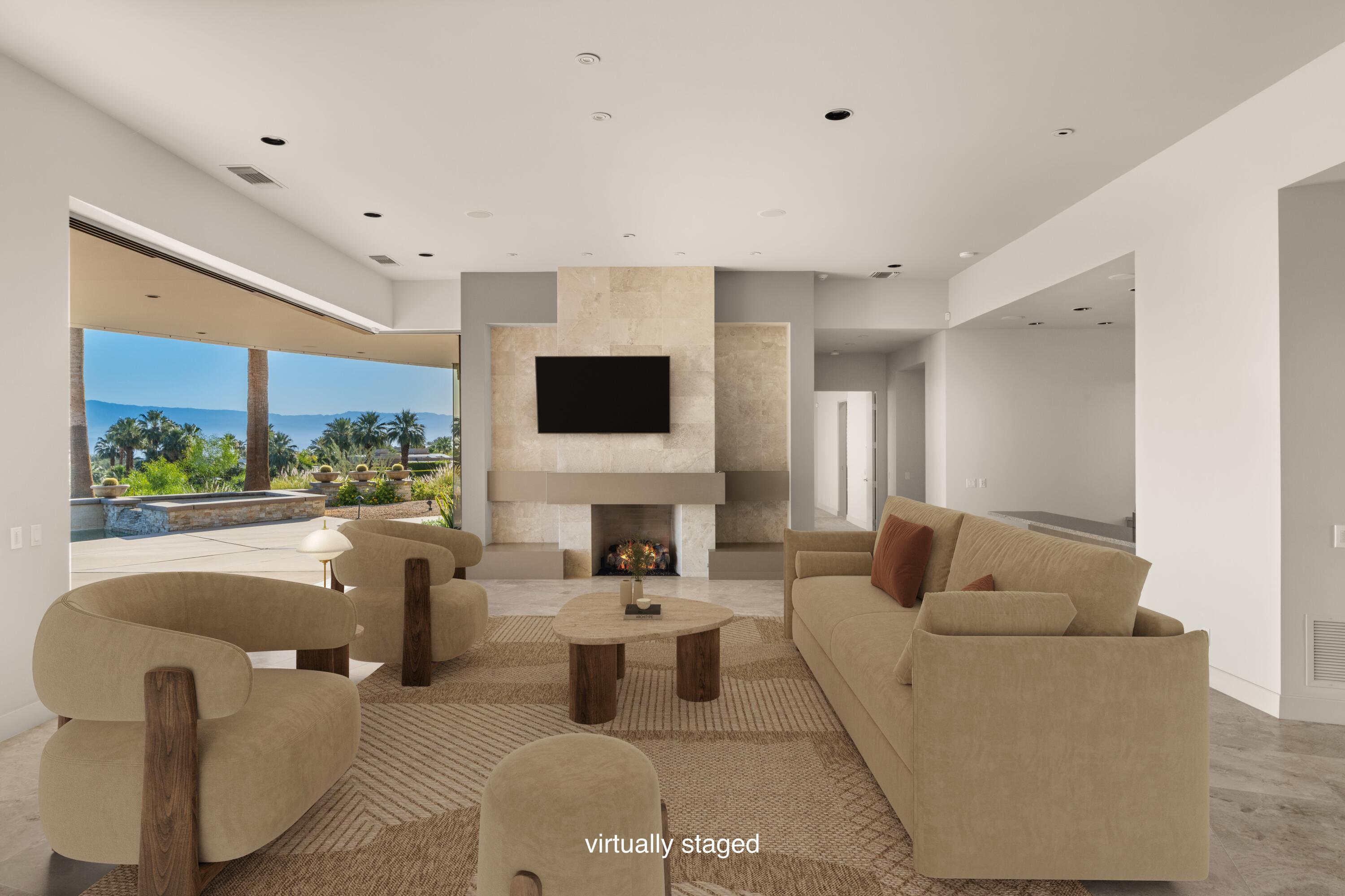 30 Hillcrest Drive Rancho Mirage, CA 92270 - Photo 7 of 79 a living room with fireplace furniture and a flat screen tv