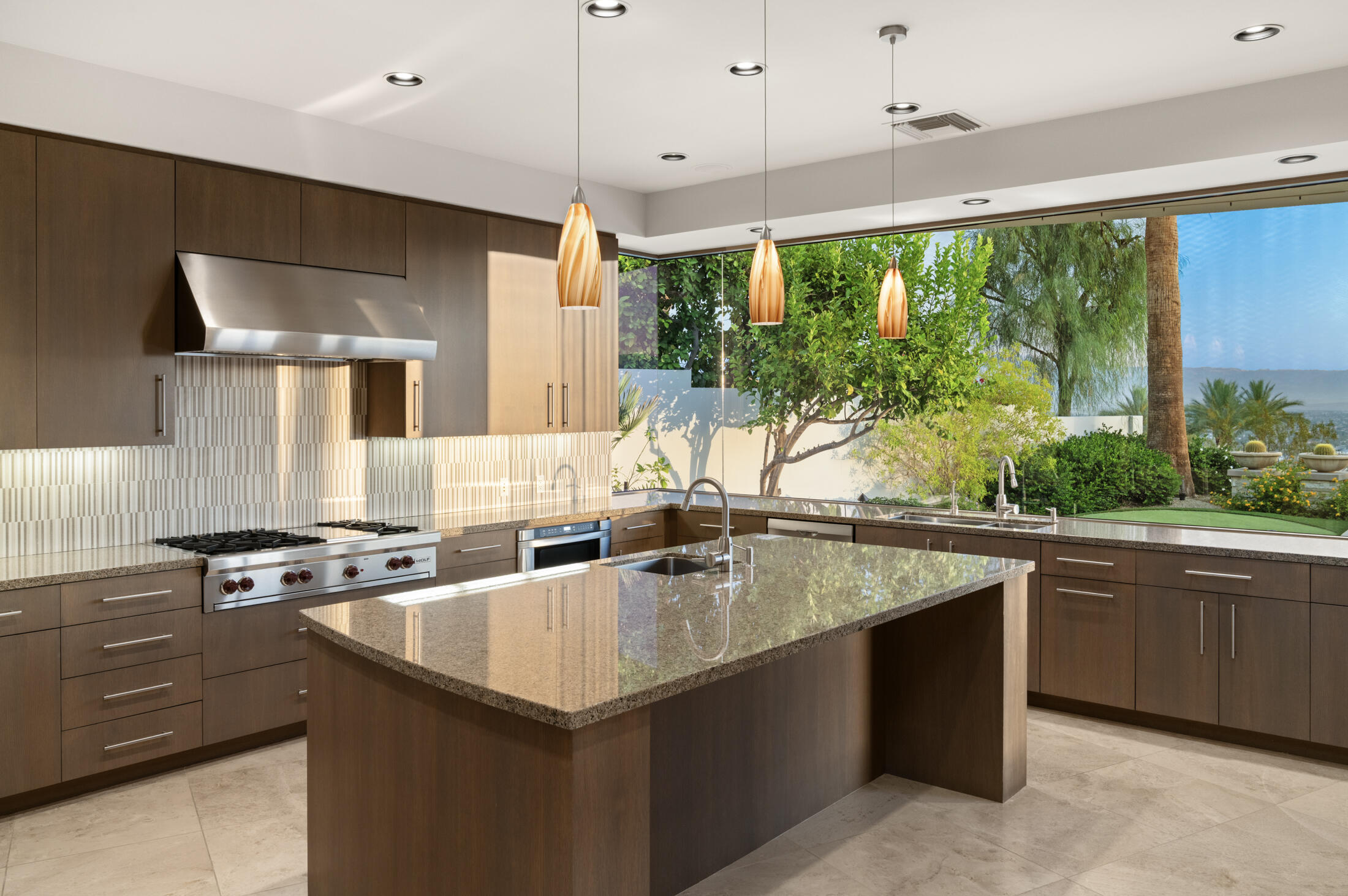 30 Hillcrest Drive Rancho Mirage, CA 92270 - Photo 10 of 79 a kitchen with stainless steel appliances granite countertop a sink a stove and a refrigerator