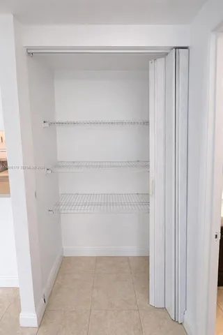 a aerial view of a house with garden space and lake view