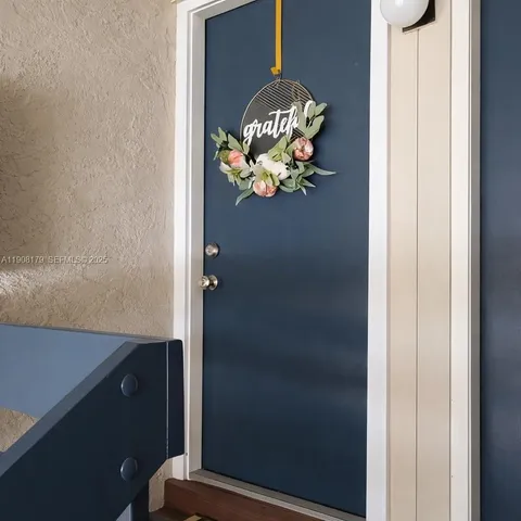 a view of a room with a wooden table and a table