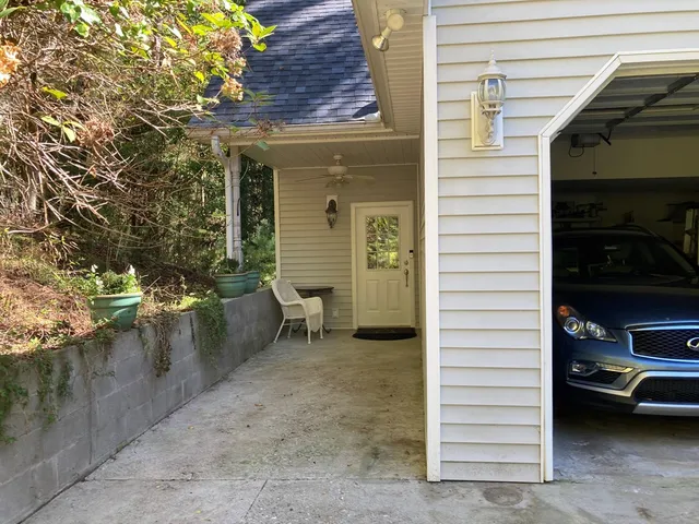 a view of potted plants in front of house