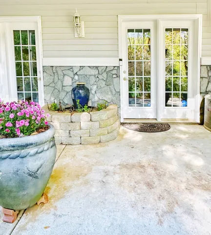 a utility room with a sink a cabinetry and appliances