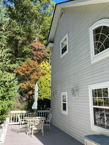 a backyard of a house with outdoor seating