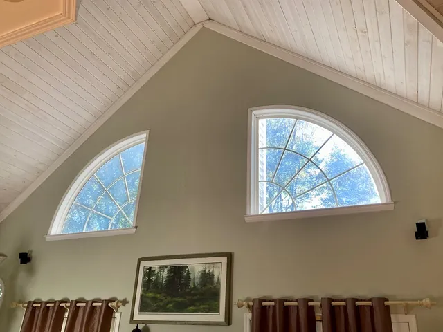 a view of wooden floor and a window