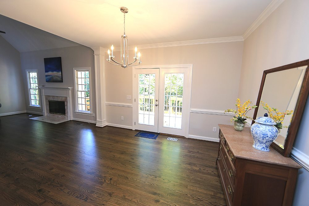 1901 Russell Drive Raleigh, NC 27612 - Photo 5 of 18 Dining Room open to Family Room with chair rail, french doors to deck and refinished hardwood floors. Dining Room