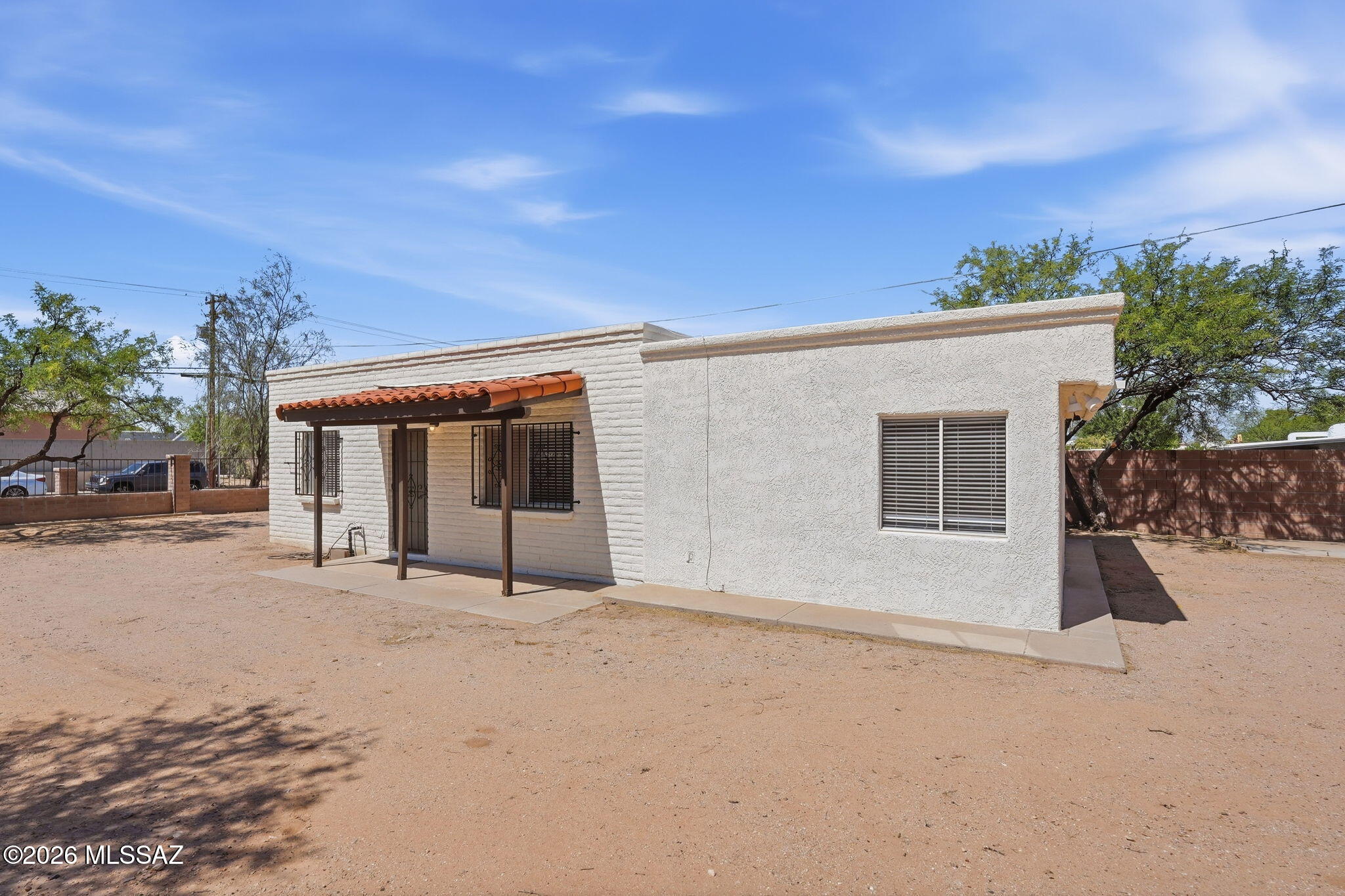 136 West Elvira Road Tucson, AZ 85756 - Photo 7 of 27 a front view of a house with a yard and garage