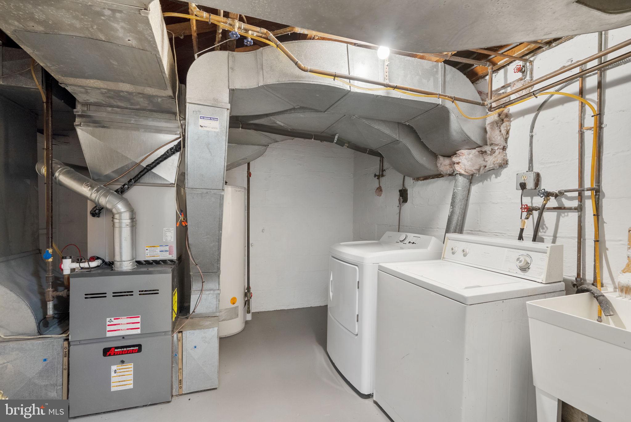 9911 Renfrew Road Silver Spring, MD 20901 - Photo 41 of 49 Functional laundry space with utilities.
