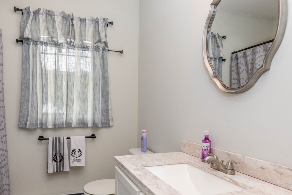 20 Jewett Hill Road Ashby, MA 01431 - Photo 11 of 14 a bathroom with a granite countertop sink and a mirror
