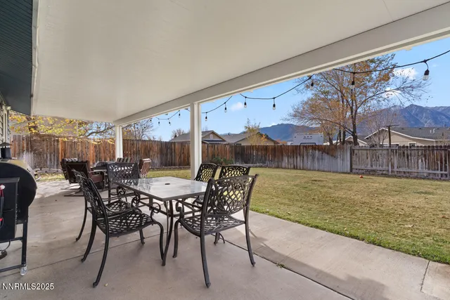 a view of a dining room with furniture window and outdoor view