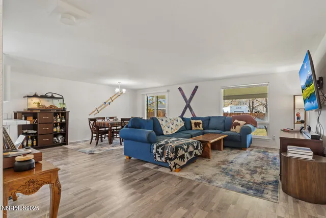 a bedroom with furniture and a wooden floor