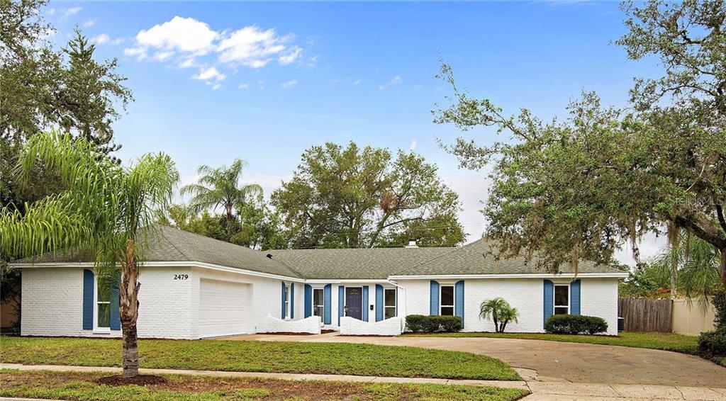 2479 Fieldingwood Road Maitland, FL 32751 - Photo 1 of 1 a front view of a house with a yard