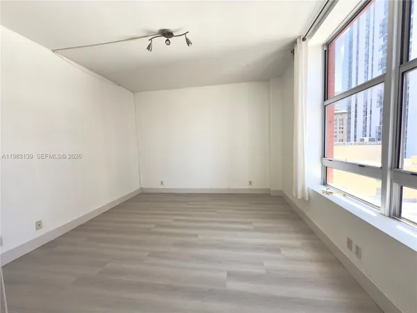 a view of an empty room with a window