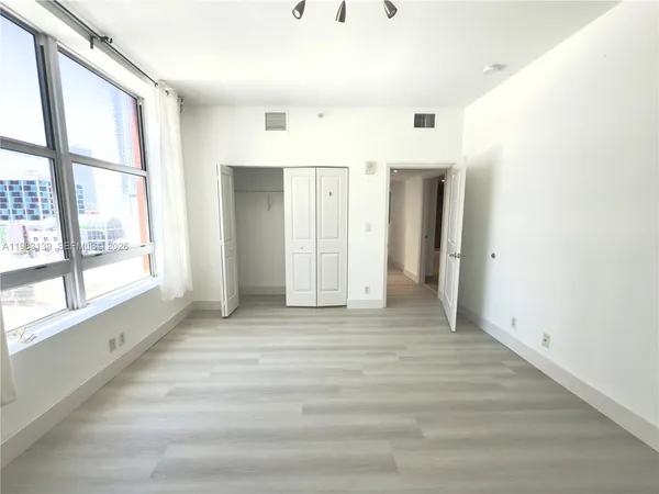 a view of an empty room with a window