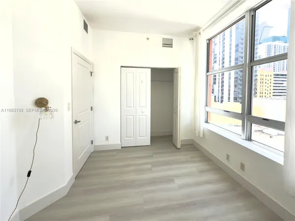 a view of an empty room with a window