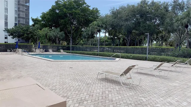 a view of backyard with tall trees