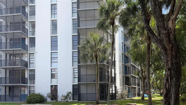 a couple of palm trees in front of building