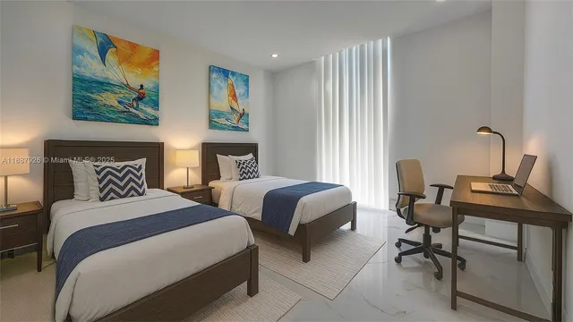 a bedroom with two beds and a desk