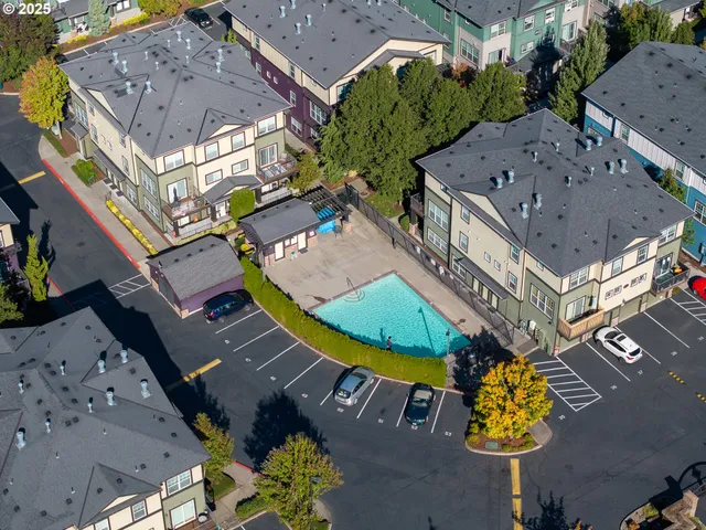 an aerial view of houses with yard