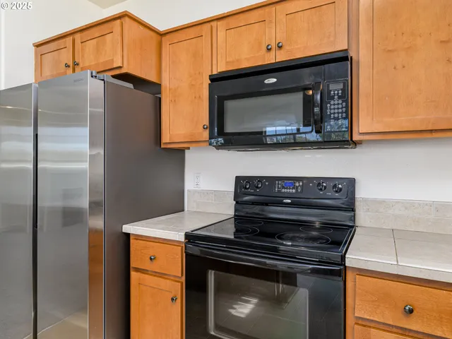a kitchen with a stove and a microwave