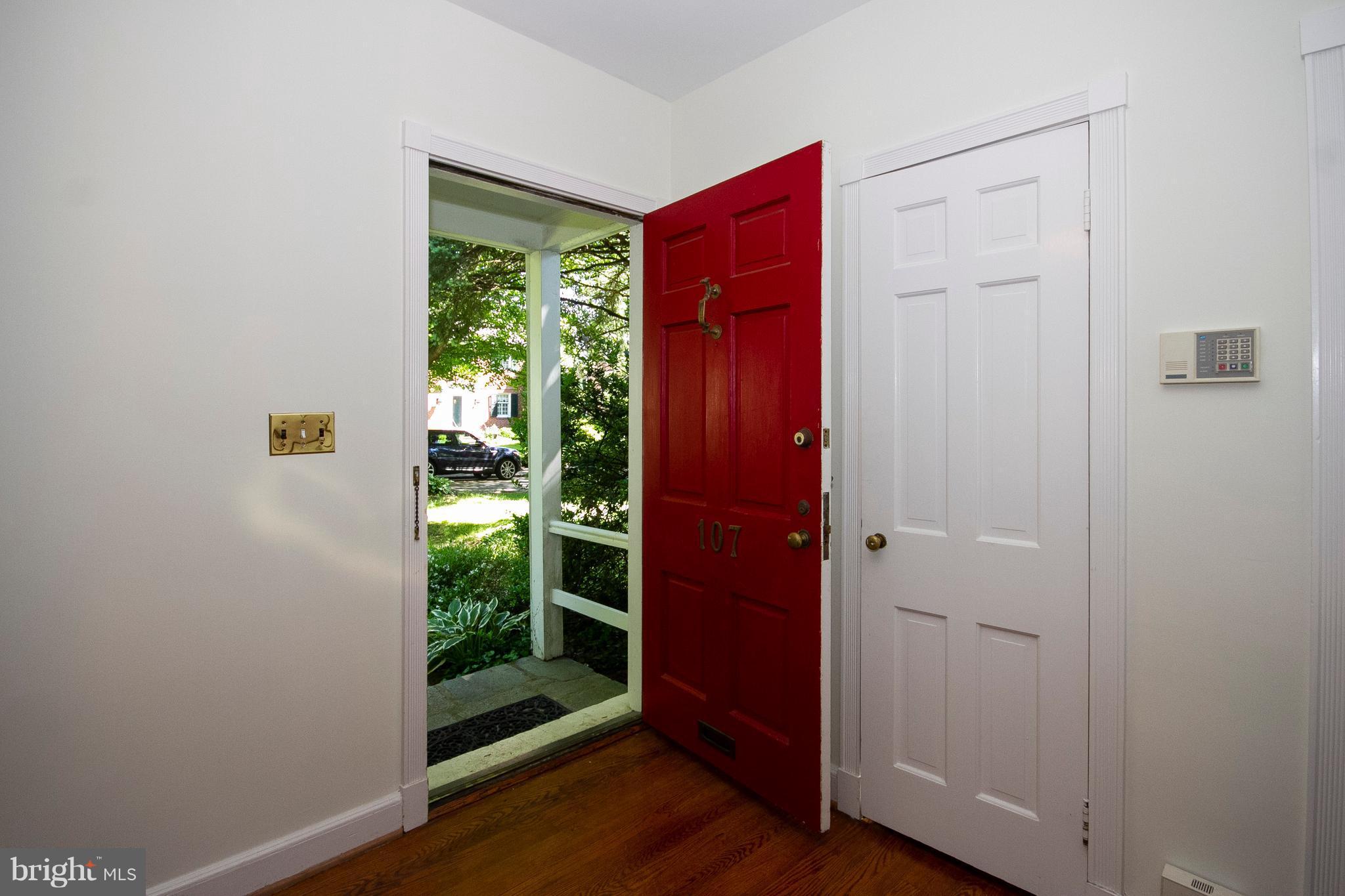 107 Taplow Road Baltimore, MD 21212 - Photo 2 of 30 Foyer with hardwood floors and guest closet.
