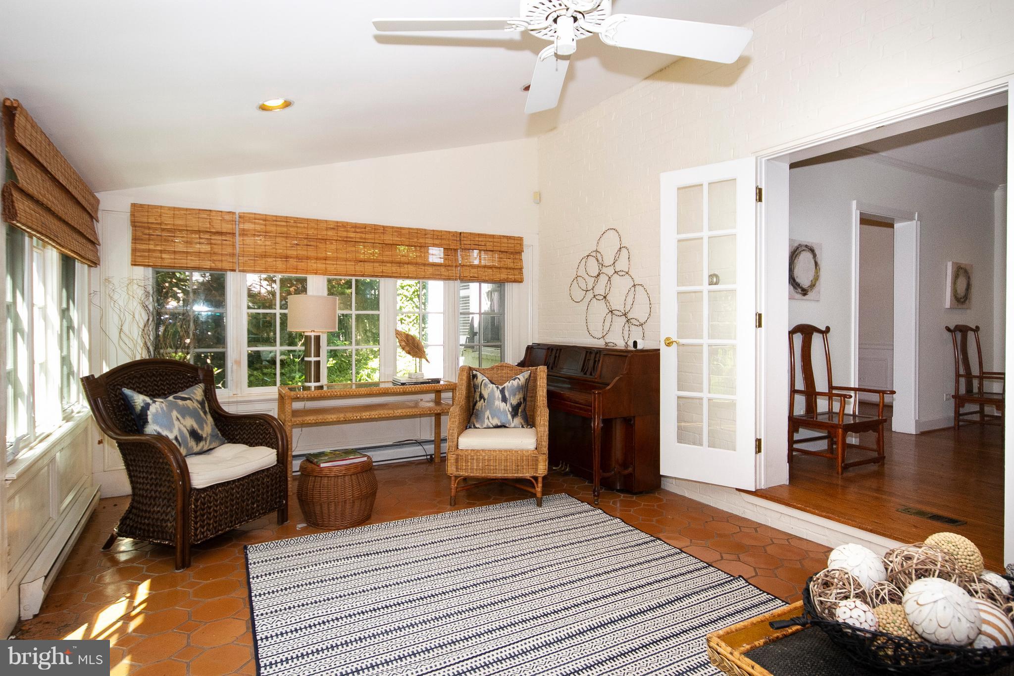 107 Taplow Road Baltimore, MD 21212 - Photo 15 of 30 Family Room w/ ceiling fan and ceramic tile floor.