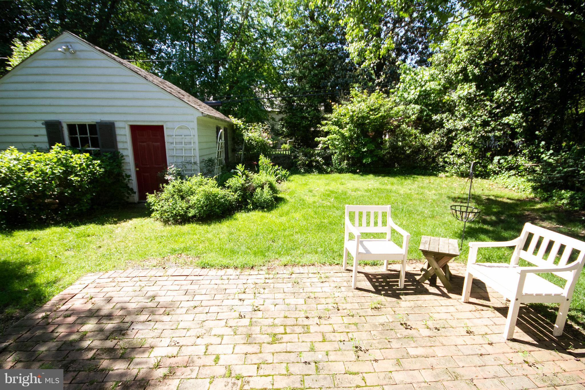 107 Taplow Road Baltimore, MD 21212 - Photo 30 of 30 Level yard, brick patio and access to garage.
