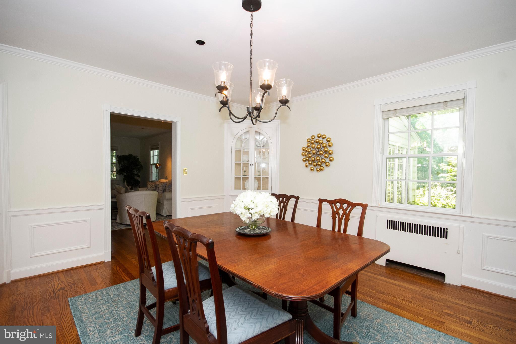 107 Taplow Road Baltimore, MD 21212 - Photo 7 of 30 Dining Room with hardwood floors and wainscoting .