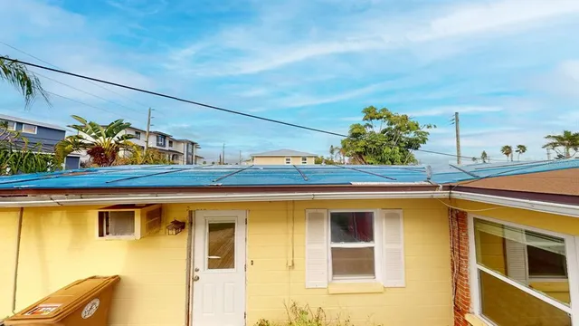 a view of a bathroom with a sink and a mirror