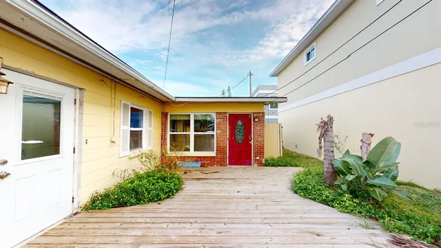 an aerial view of a house with yard