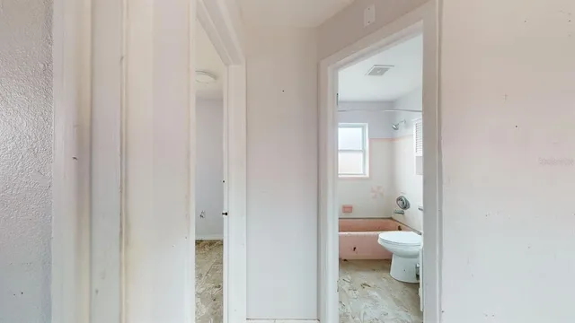 a view of a kitchen with a sink and a window
