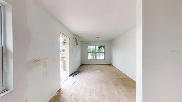 a view of a hallway with an empty room