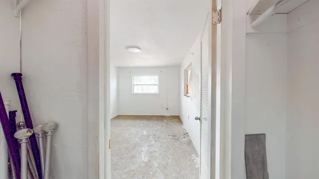 a view of an empty room with a window