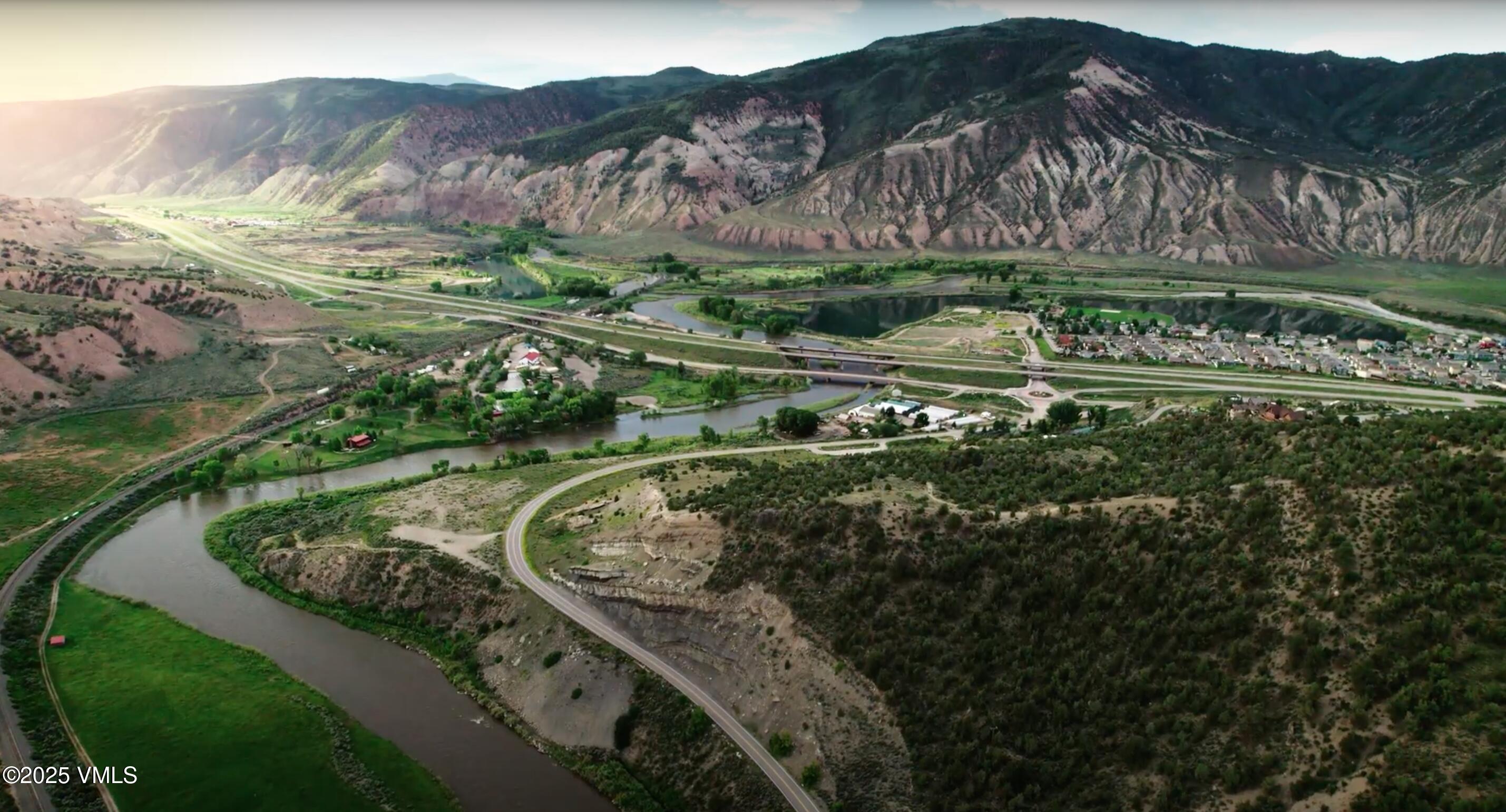 a view of a water with a yard and green space