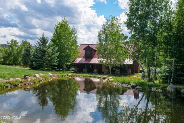a view of a lake with a yard