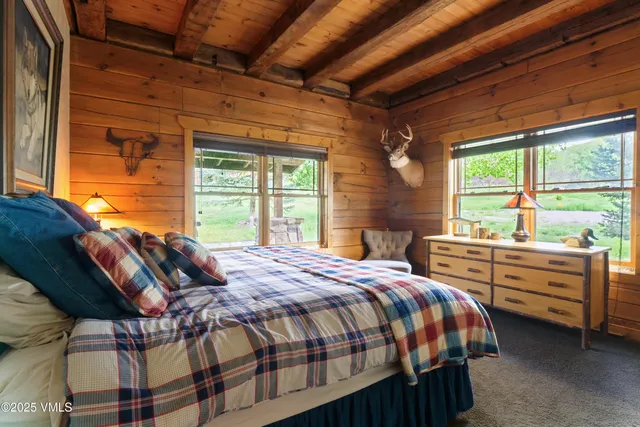 a bedroom with furniture and a window