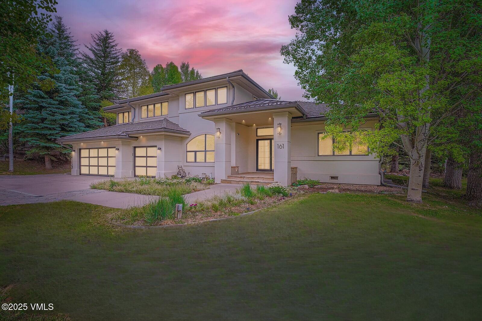 161 Stagecoach Road Edwards, CO 81632 - Photo 2 of 48 a front view of a house with a garden and yard
