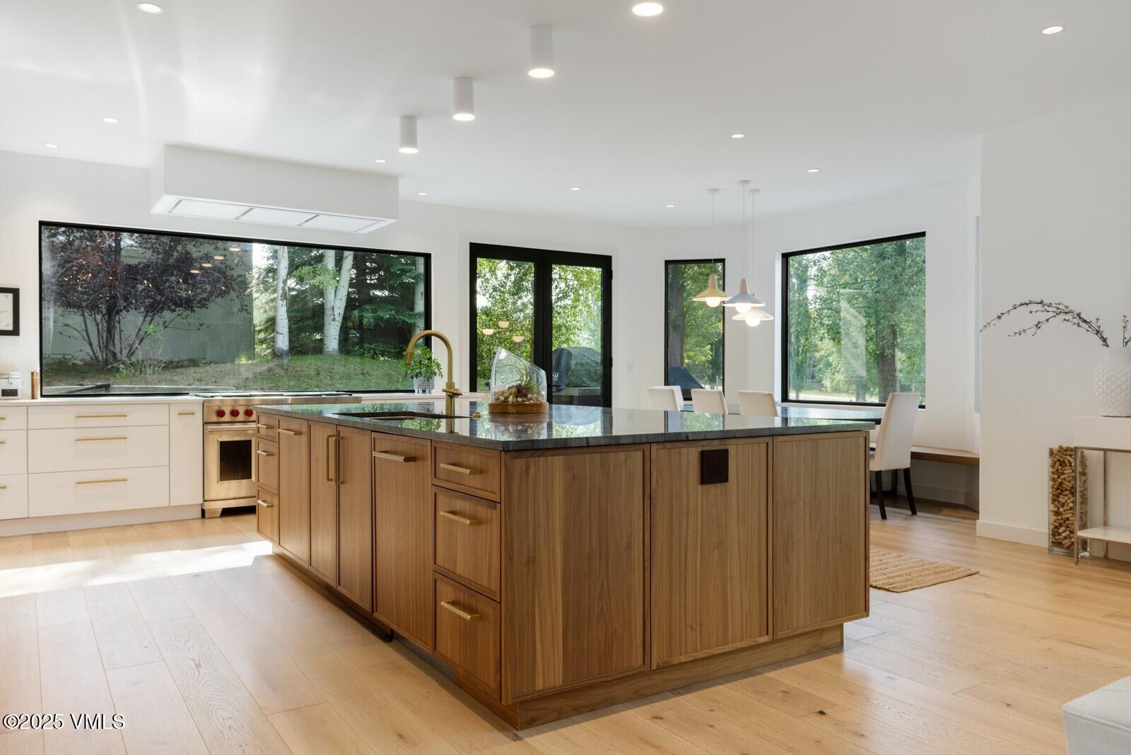 161 Stagecoach Road Edwards, CO 81632 - Photo 6 of 48 a kitchen with stainless steel appliances granite countertop a stove and a sink