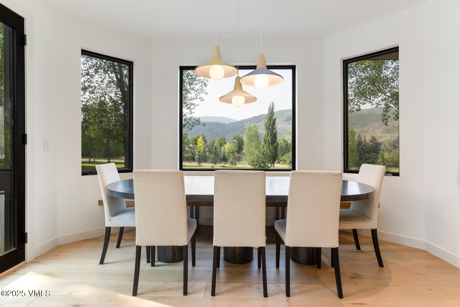 161 Stagecoach Road Edwards, CO 81632 - Photo 8 of 48 a dining room with furniture a rug and a floor to ceiling window