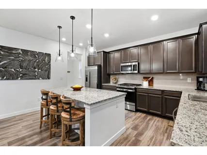 a kitchen with lots of counter top space and appliances