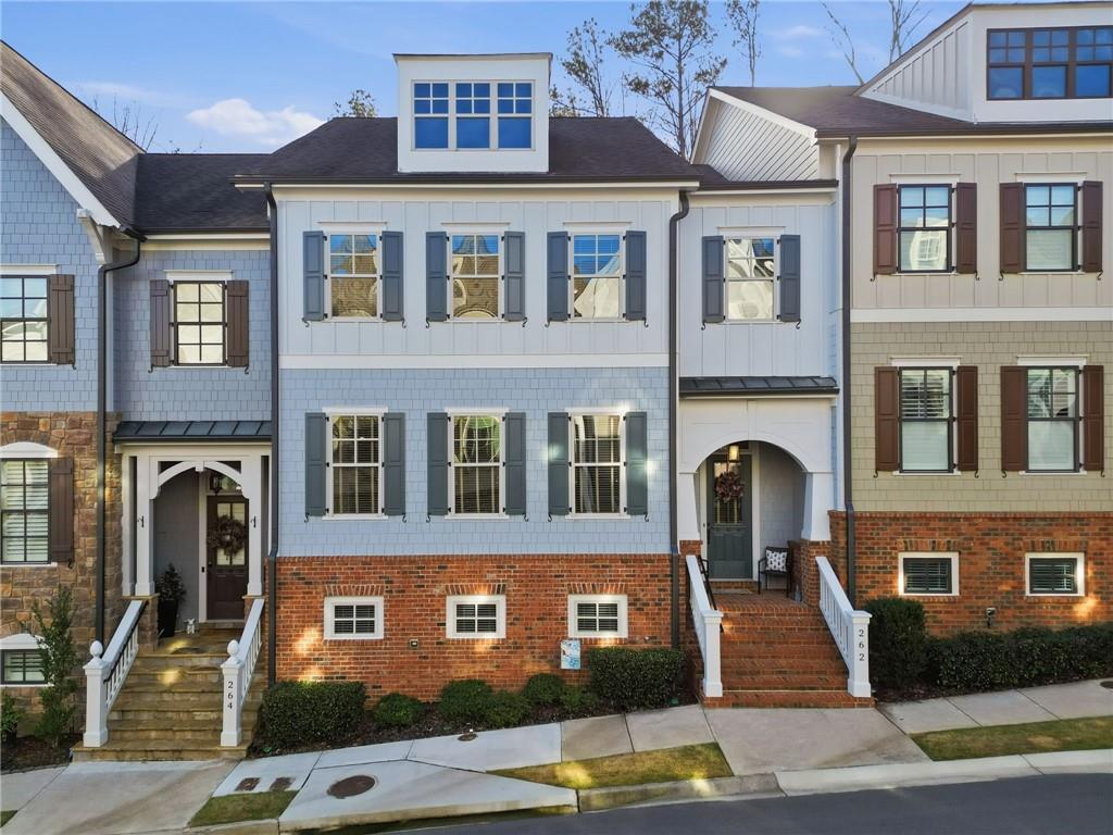 a front view of a building with many windows