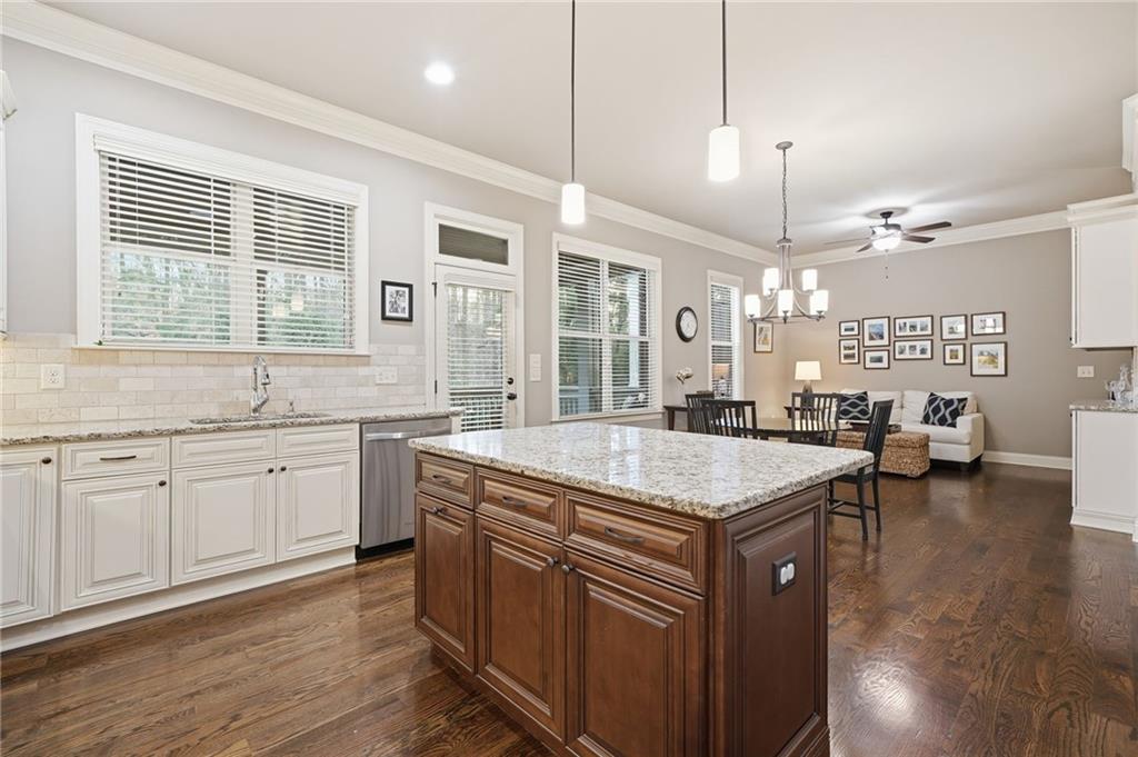 262 Trecastle Square Canton, GA 30114 - Photo 15 of 46 a kitchen with a stove center island and windows