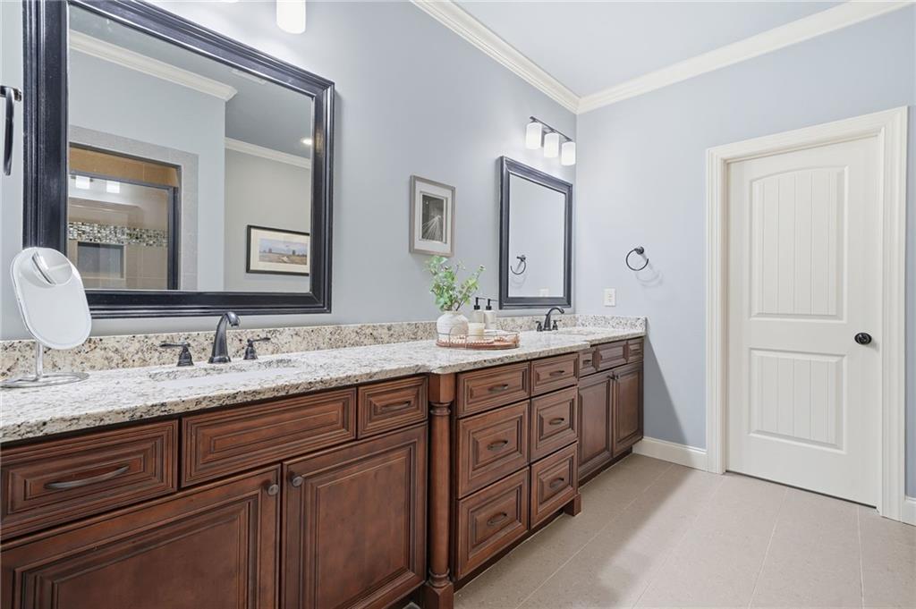 262 Trecastle Square Canton, GA 30114 - Photo 25 of 46 a bathroom with a granite countertop sink double and mirror