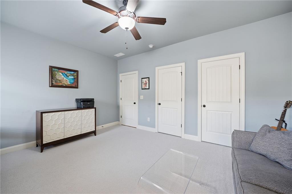 262 Trecastle Square Canton, GA 30114 - Photo 31 of 46 a living room with furniture and a ceiling fan
